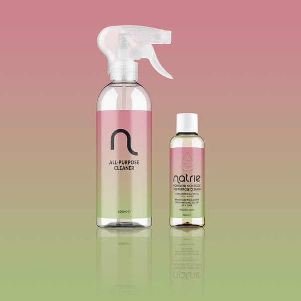 Two bottles of Natrie cleaning products on a gradient pink to green background